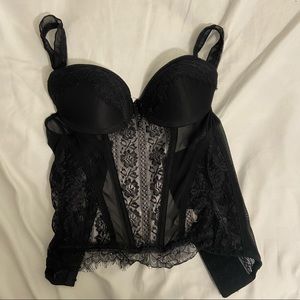 Black lingerie top slightly ripped from the back
